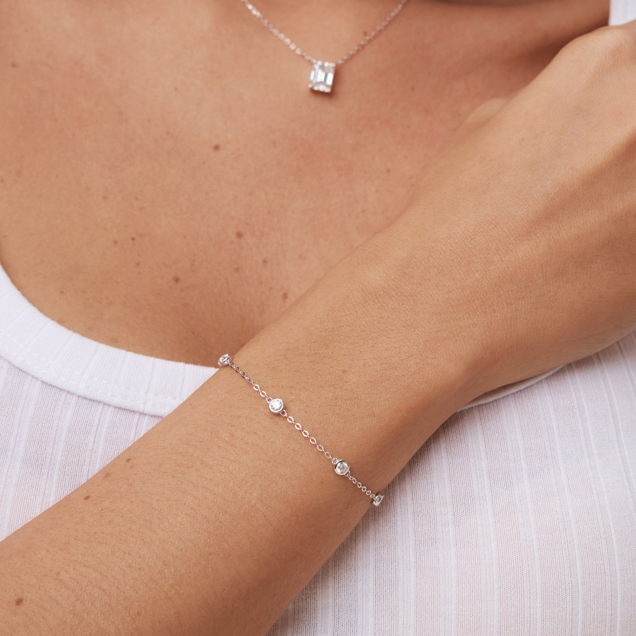 Moissanite station bracelet worn on the wrist.