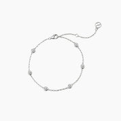 Moissanite station bracelet in white gold vermeil, full product view.