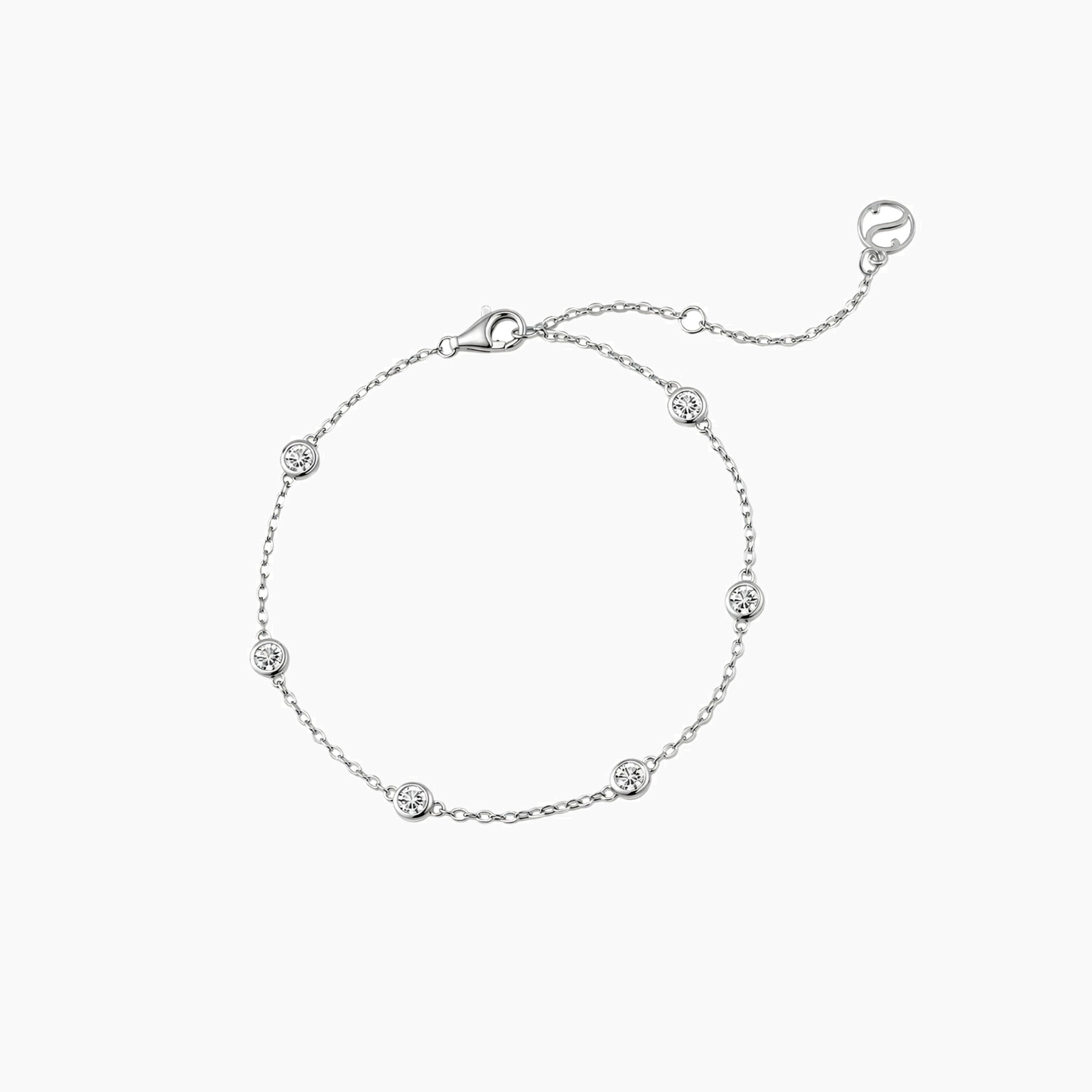 Moissanite station bracelet in white gold vermeil, full product view.