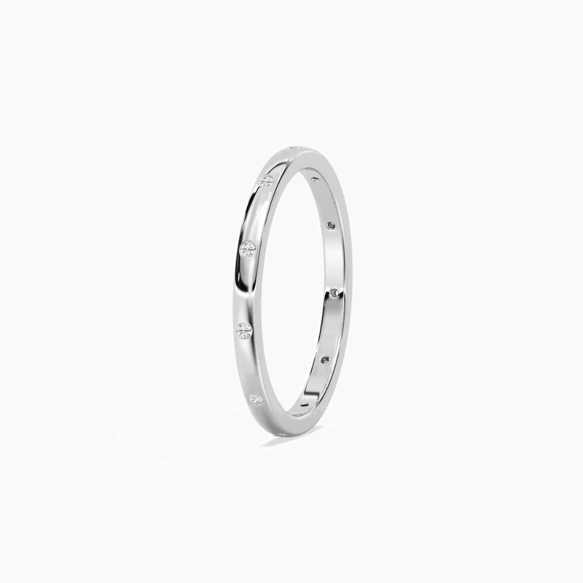 Moissanite station ring in white gold vermeil, side view.