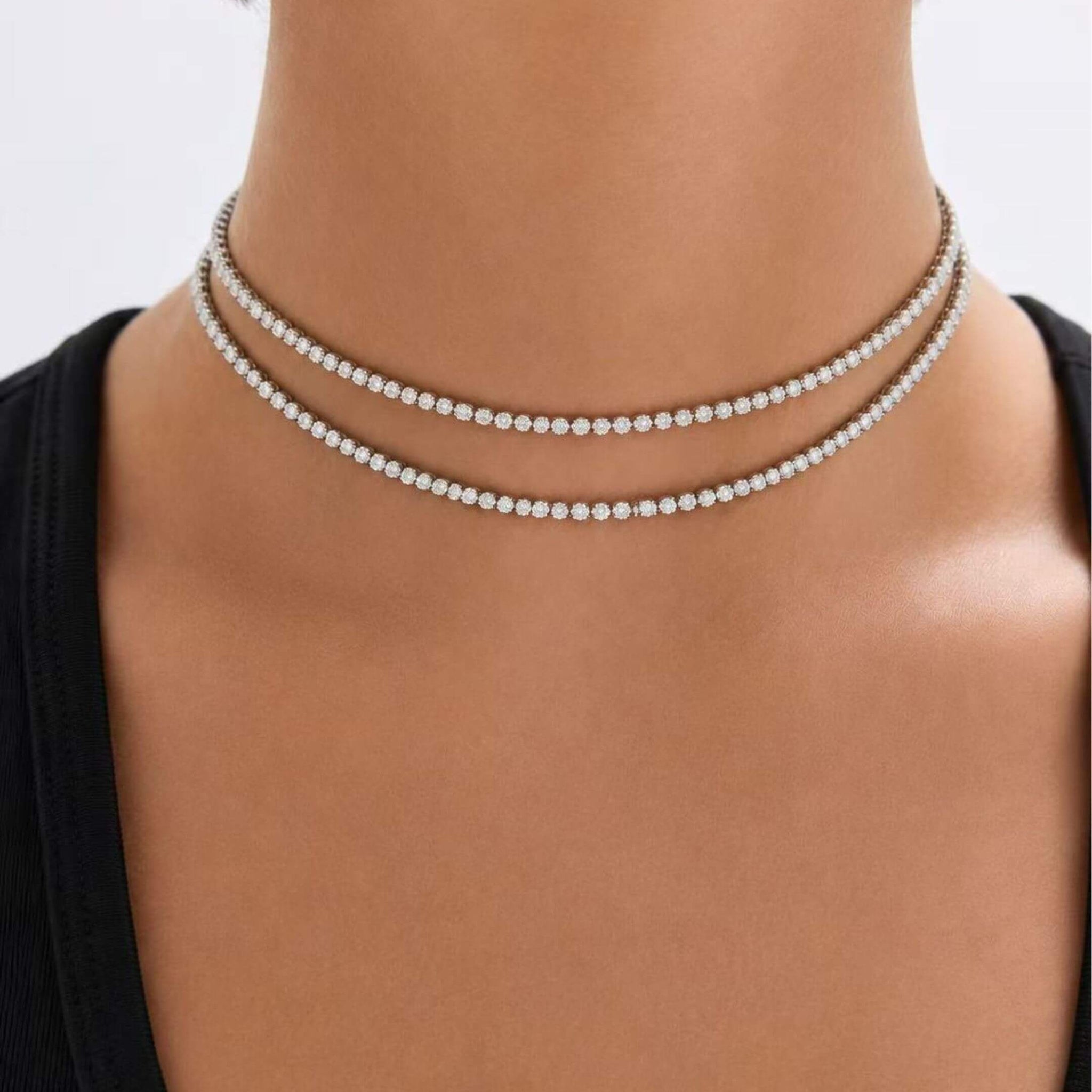 Multiway moissanite tennis choker and bracelet worn at the neckline.