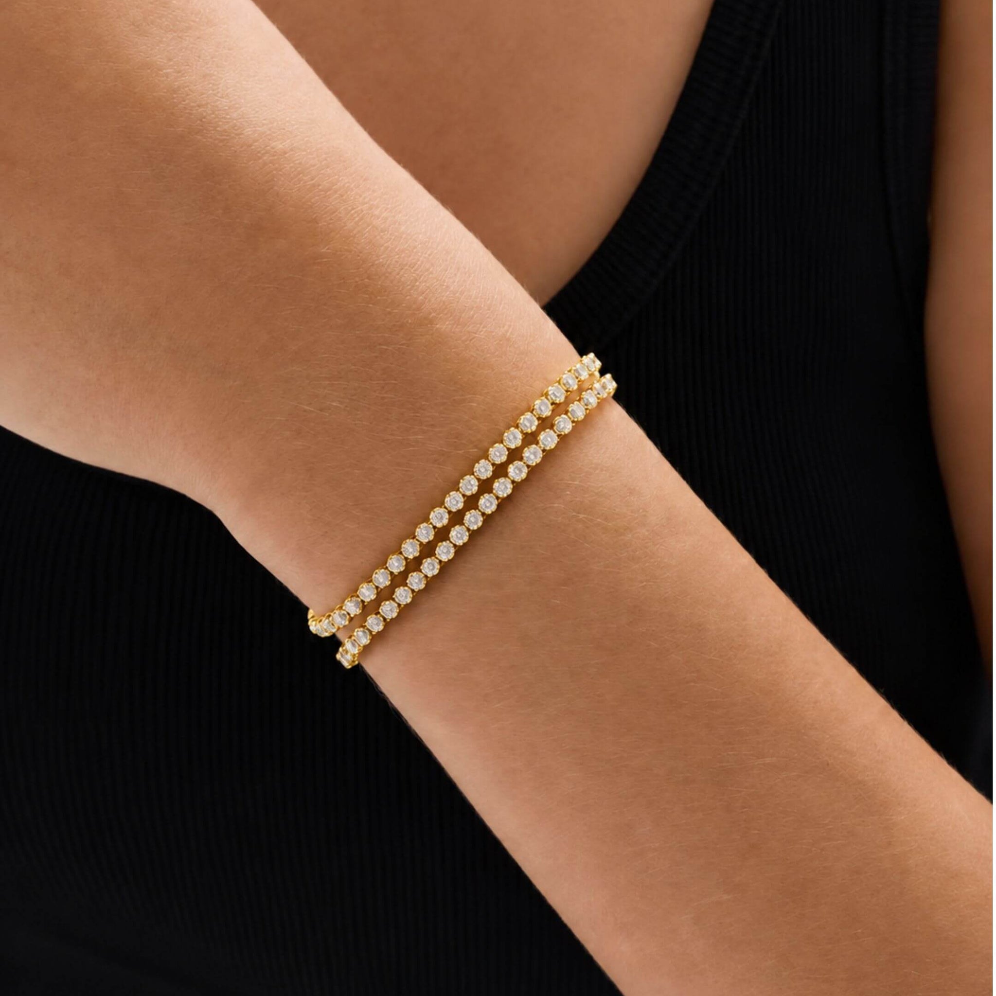 Multiway moissanite tennis choker and bracelet wrapped around the wrist in the bracelet configuration.