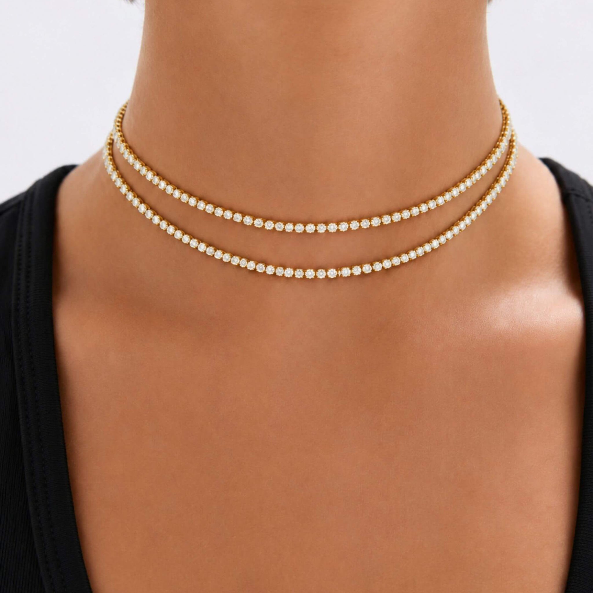 Multiway moissanite tennis choker and bracelet worn at the neckline.