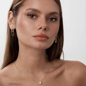 Multiway pavé moissanite link earrings worn on the ear.