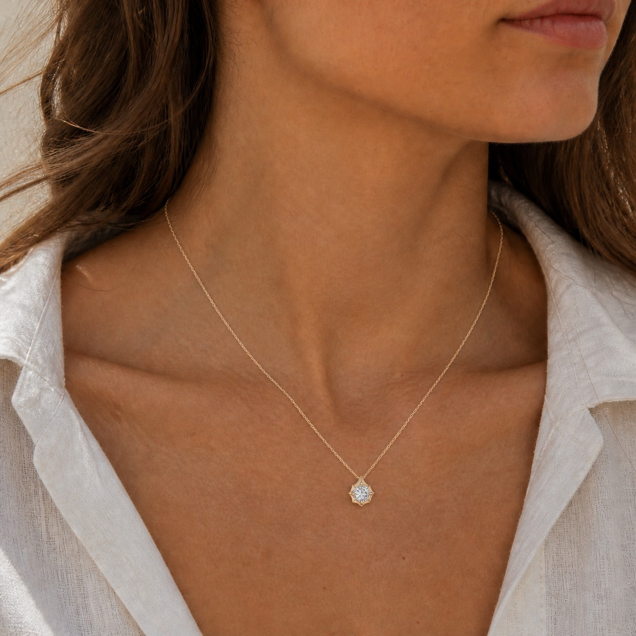 2 ct Round-Cut Moissanite Bezel-Prong Pendant Necklace in 18k yellow gold vermeil, worn on a model.