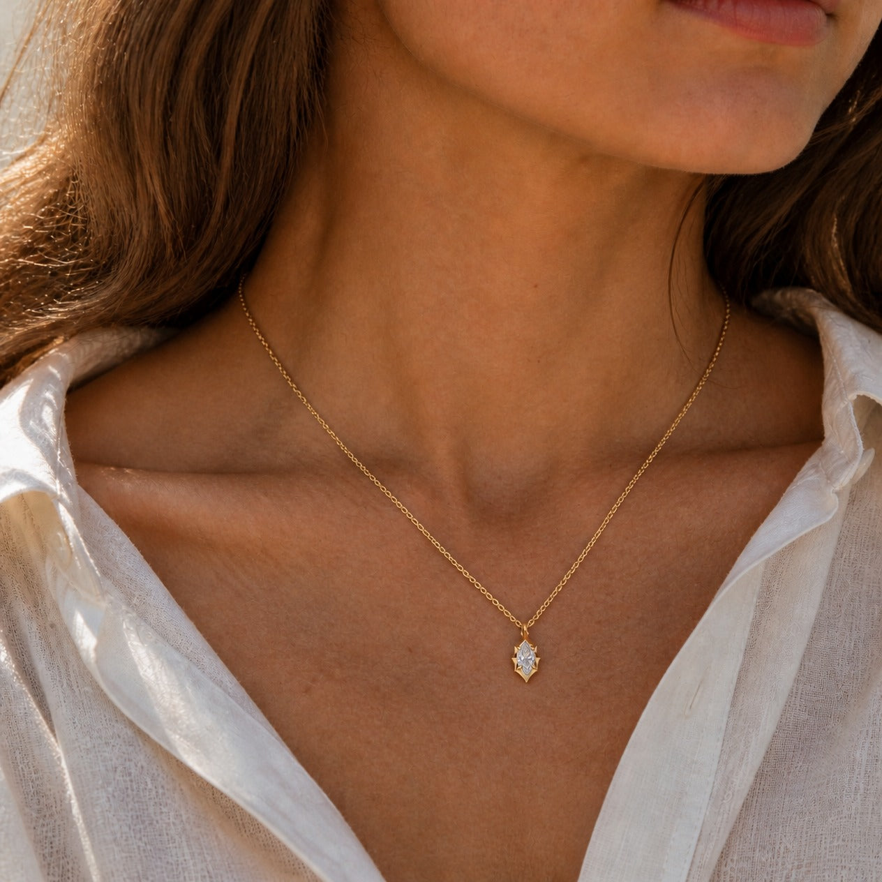 2 ct Marquise-Cut Moissanite Bezel-Prong Pendant Necklace in 18k yellow gold vermeil, worn on a model.