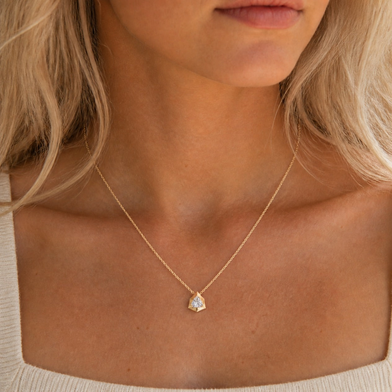 2 ct Trillion-Cut Moissanite Bezel-Prong Pendant Necklace in 18k yellow gold vermeil, worn on a model.
