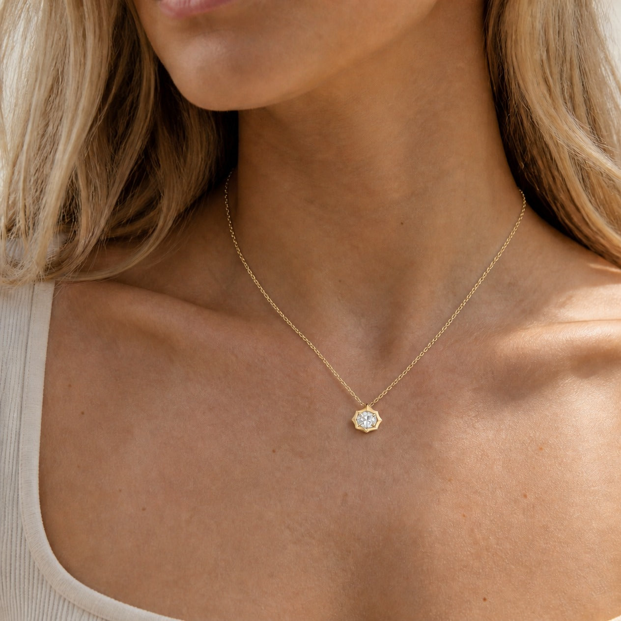 2 ct East-West Oval-Cut Moissanite Bezel-Prong Pendant Necklace in 18k yellow gold vermeil, worn on a model.