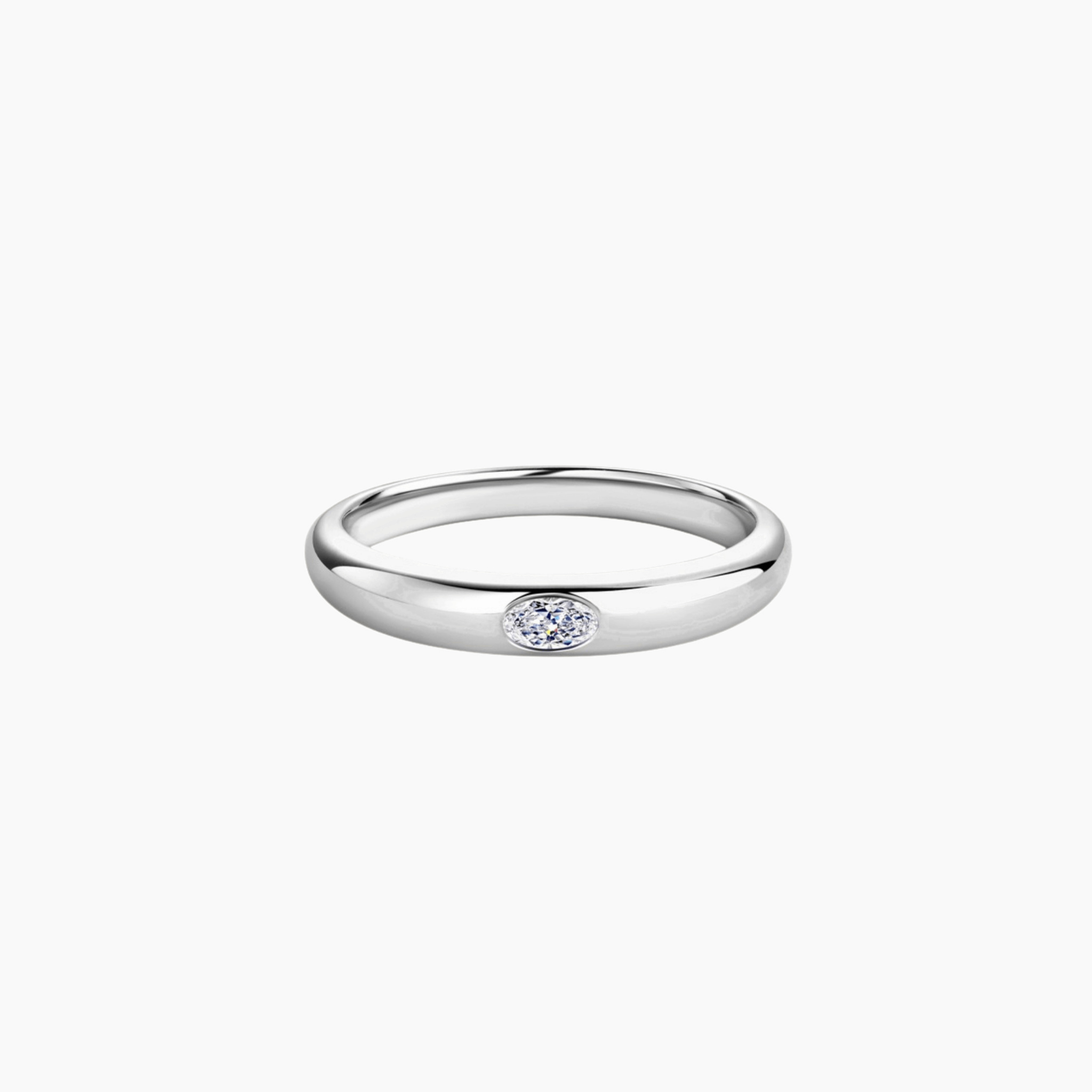 Oval-cut moissanite bezel dome ring in white gold vermeil, front view.