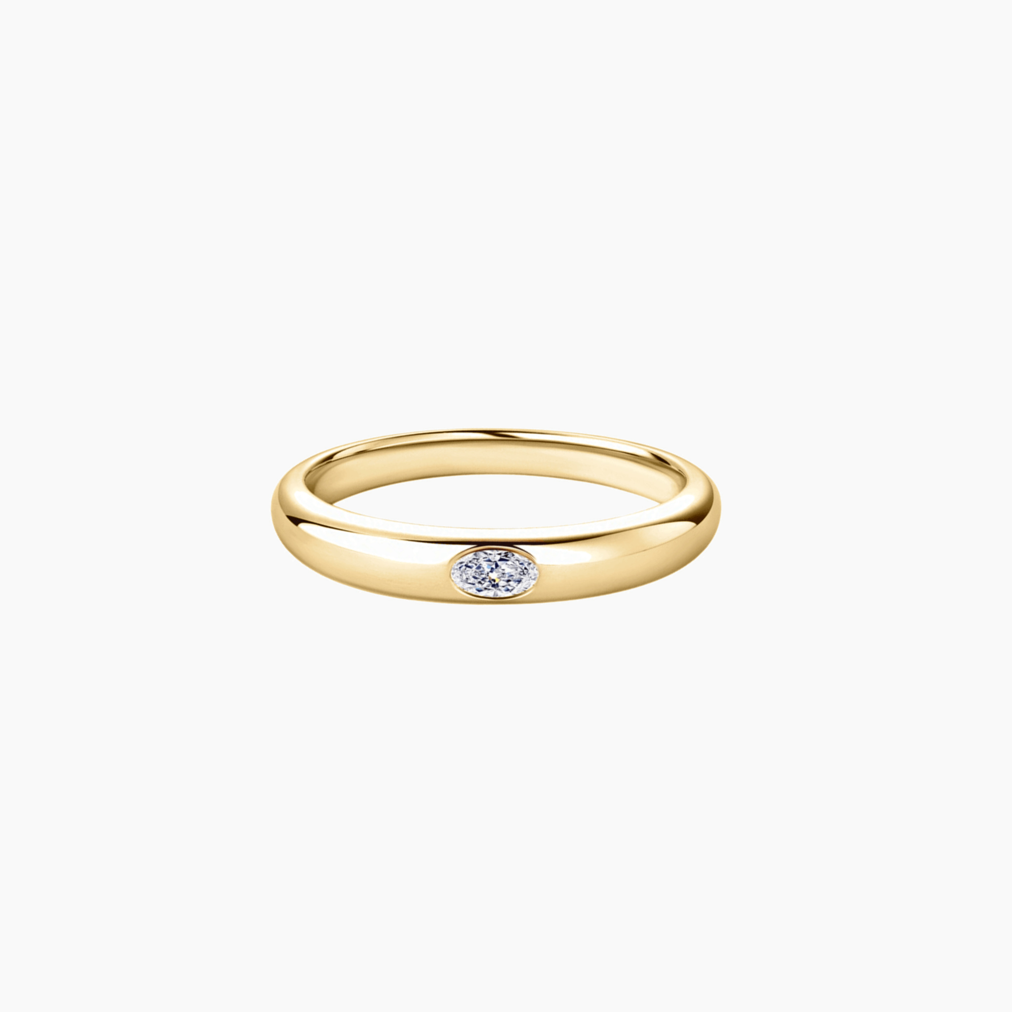 Oval-cut moissanite bezel dome ring in yellow gold vermeil, front view.