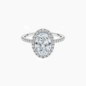 Oval-cut moissanite halo ring with pavé band in white gold vermeil, front view.