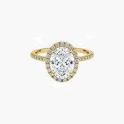 Oval-cut moissanite halo ring with pavé band in yellow gold vermeil, front view.