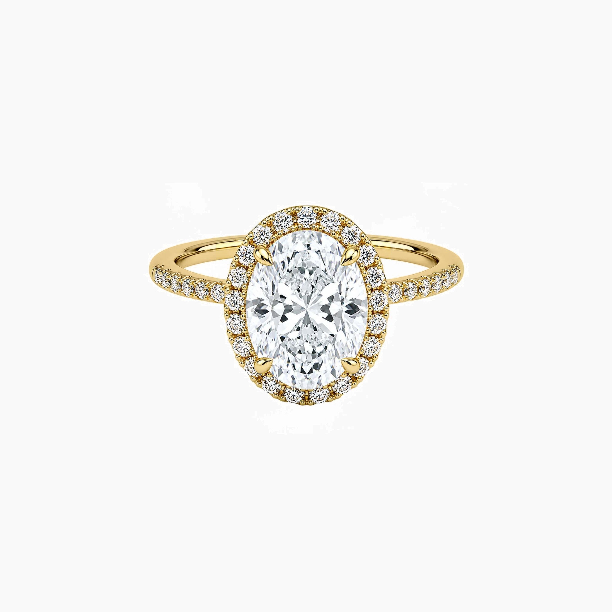 Oval-cut moissanite halo ring with pavé band in yellow gold vermeil, front view.
