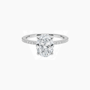 Oval-cut moissanite hidden halo ring with pavé band in white gold vermeil, front view.