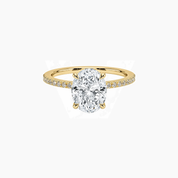 Oval-cut moissanite hidden halo ring with pavé band in yellow gold vermeil, front view.