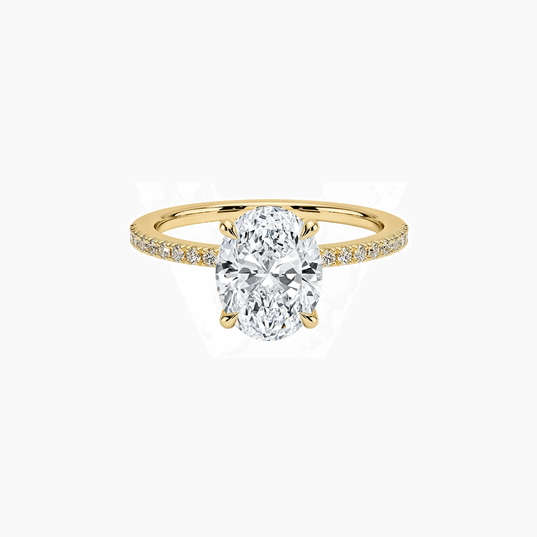Oval-cut moissanite hidden halo ring with pavé band in yellow gold vermeil, front view.