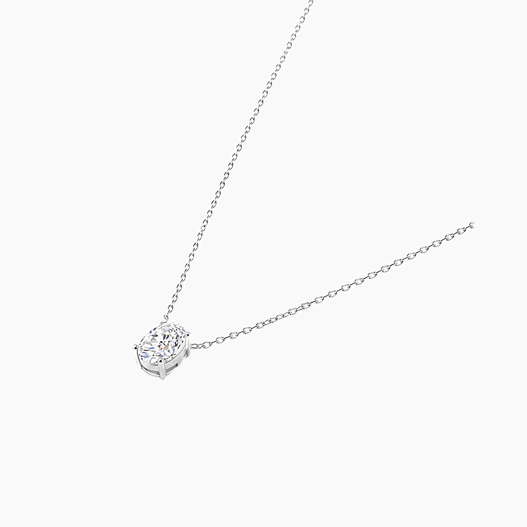 Oval-cut moissanite pendant necklace in white gold vermeil, side view.