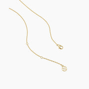 Oval-cut moissanite pendant necklace in yellow gold vermeil, clasp and chain-end detail.