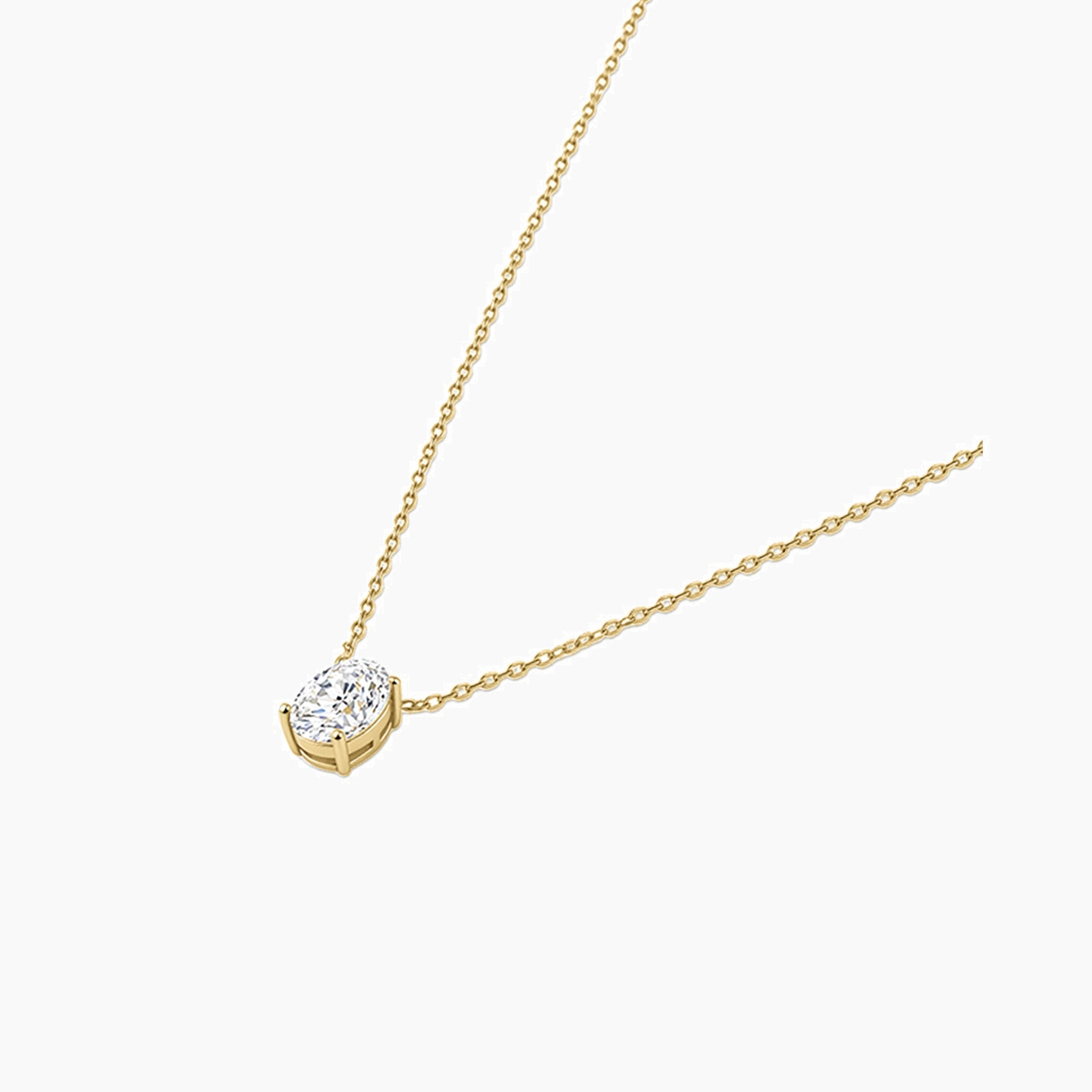 Oval-cut moissanite pendant necklace in yellow gold vermeil, side view.