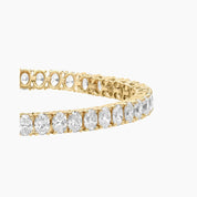 Oval-cut moissanite tennis bracelet in yellow gold vermeil, close-up detail.