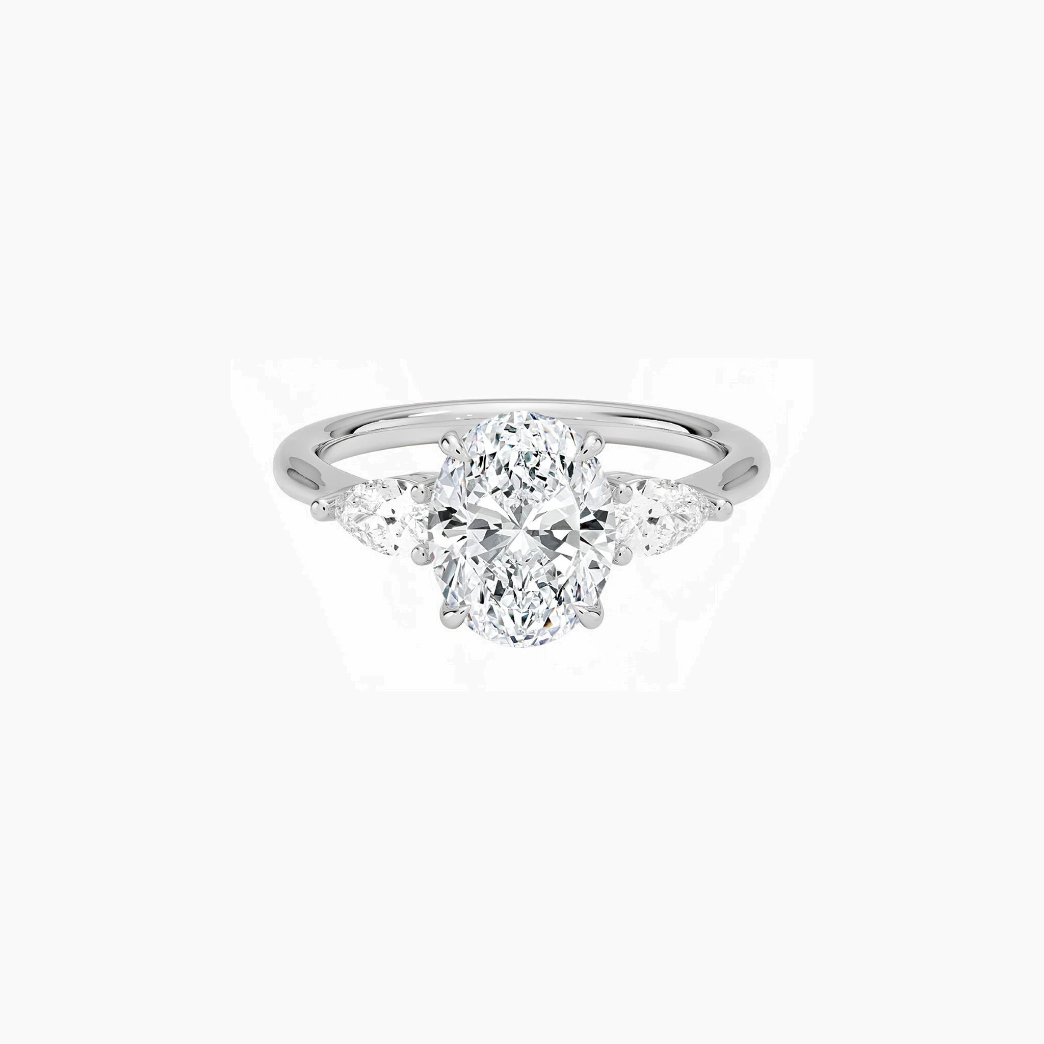 Oval-cut moissanite three-stone ring in white gold vermeil, front view.
