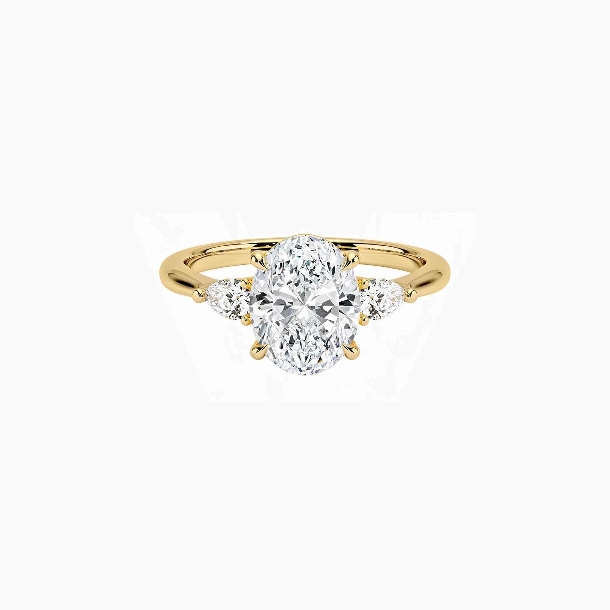 Oval-cut moissanite three-stone ring in yellow gold vermeil, front view.
