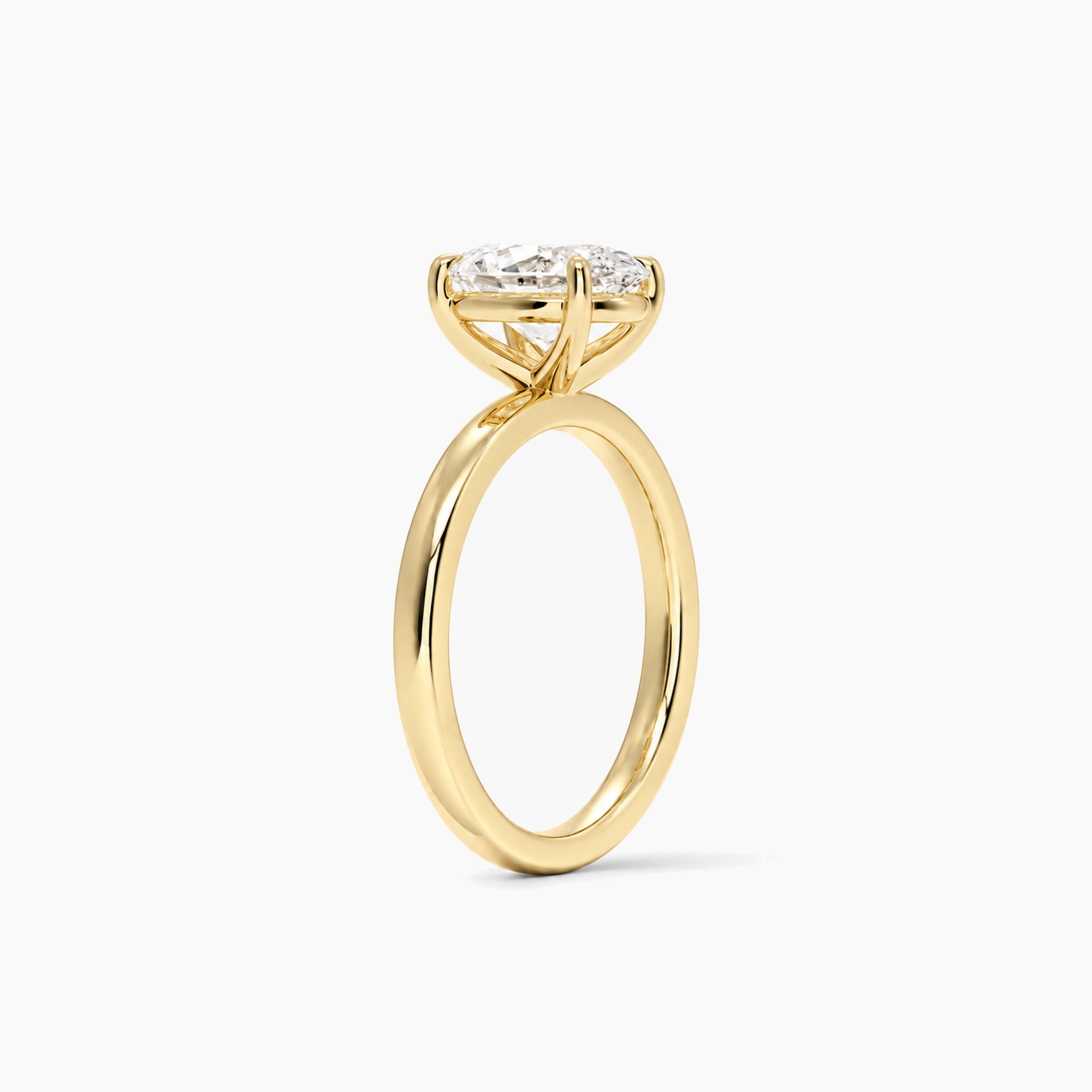 oval-cut moissanite solitaire ring in yellow gold vermeil, side view