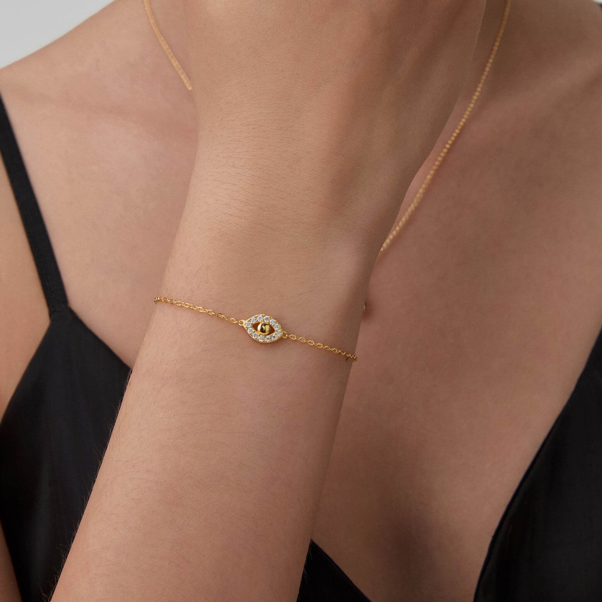 Pavé moissanite evil eye bracelet worn on the wrist.