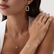 Pavé moissanite evil eye bracelet worn on the wrist.