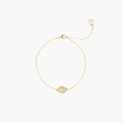 Pavé moissanite evil eye bracelet in yellow gold vermeil, full product view.