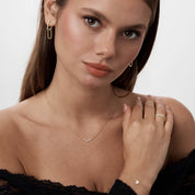 Pavé moissanite heart bracelet worn on the wrist.