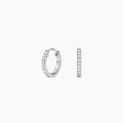 Pavé moissanite huggie hoop earrings in white gold vermeil, front and side views.