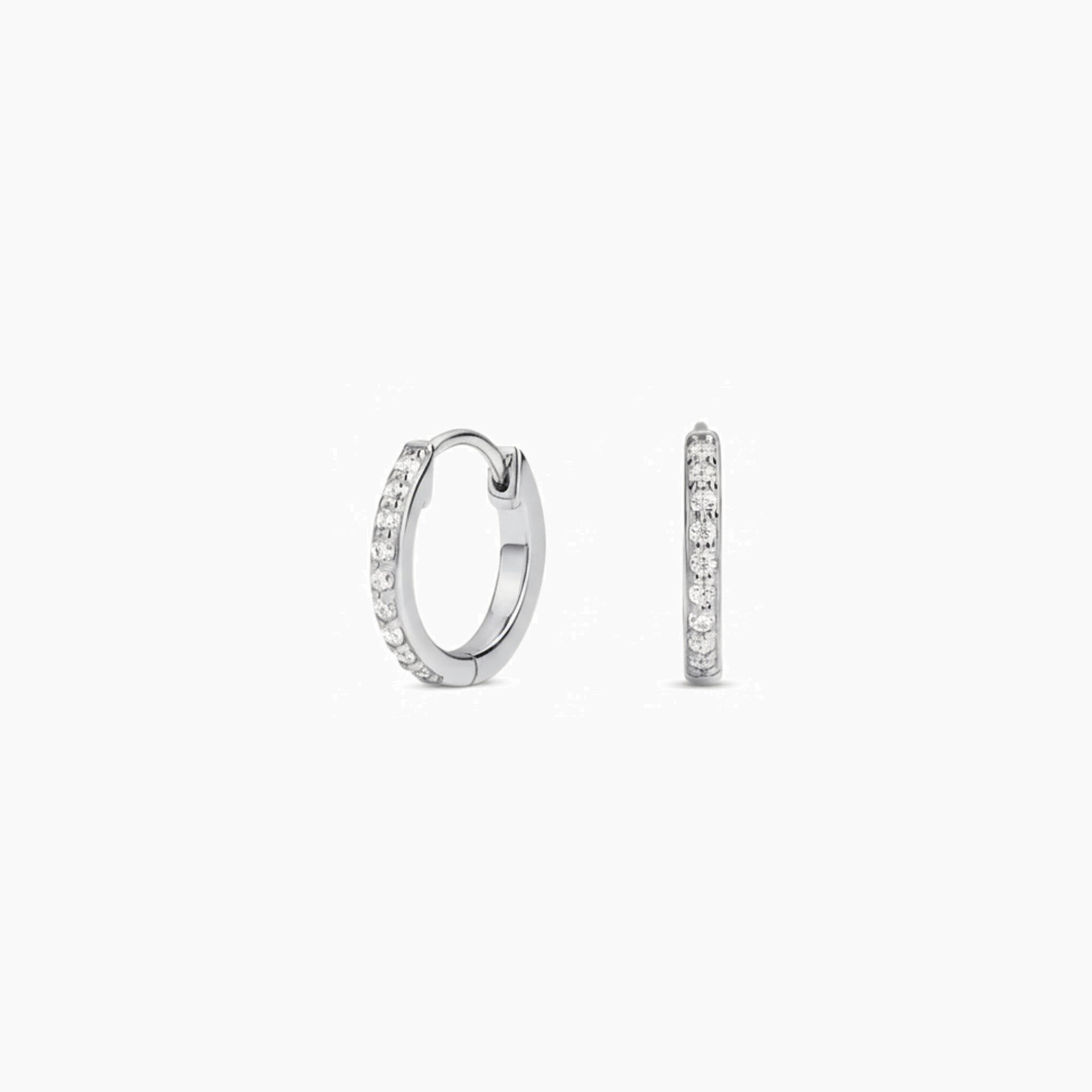 Pavé moissanite huggie hoop earrings in white gold vermeil, front and side views.