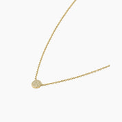 Pavé moissanite round pendant necklace in yellow gold vermeil, side view.
