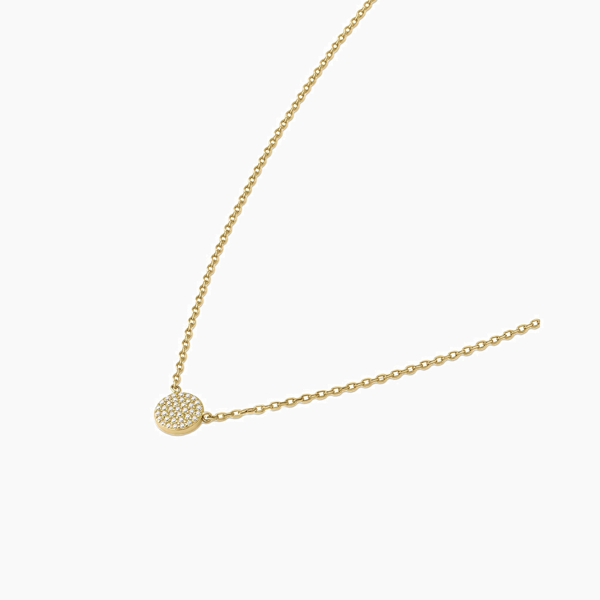 Pavé moissanite round pendant necklace in yellow gold vermeil, side view.