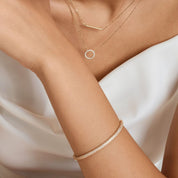 Pavé moissanite stackable bangle worn on the wrist.