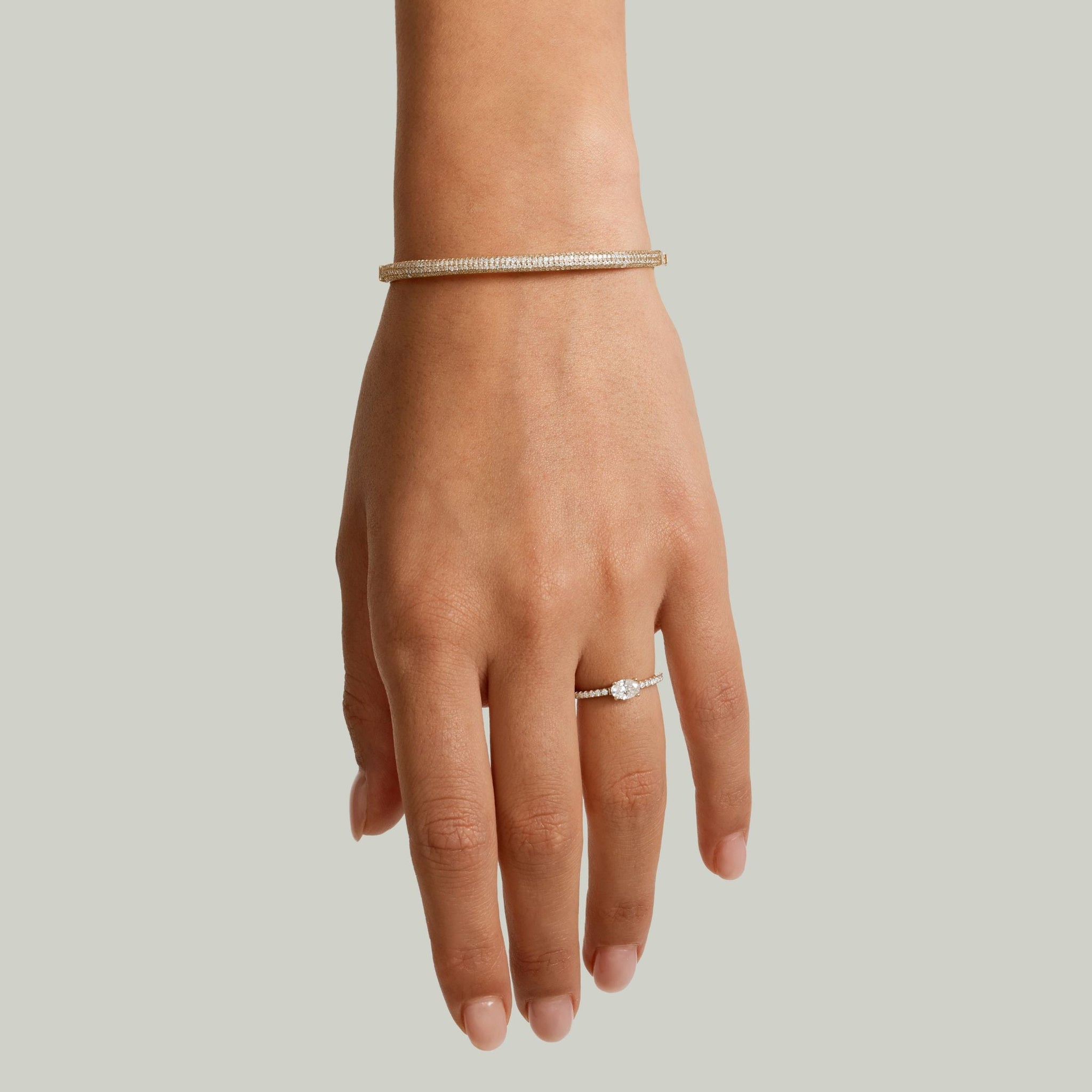 Pavé moissanite stackable bangle worn on the wrist.