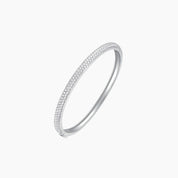 Pavé moissanite stackable bangle in white gold vermeil, angled view.
