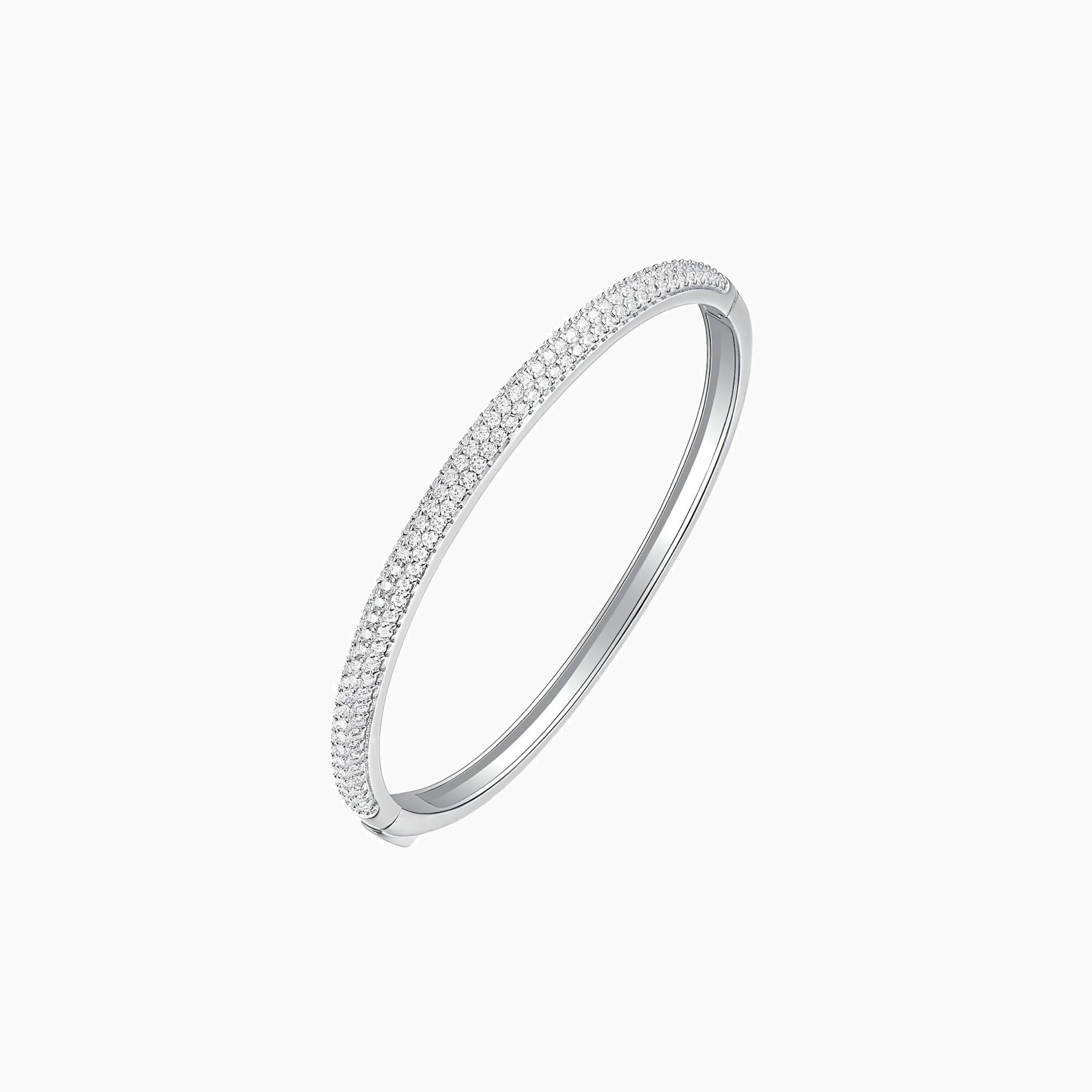 Pavé moissanite stackable bangle in white gold vermeil, angled view.