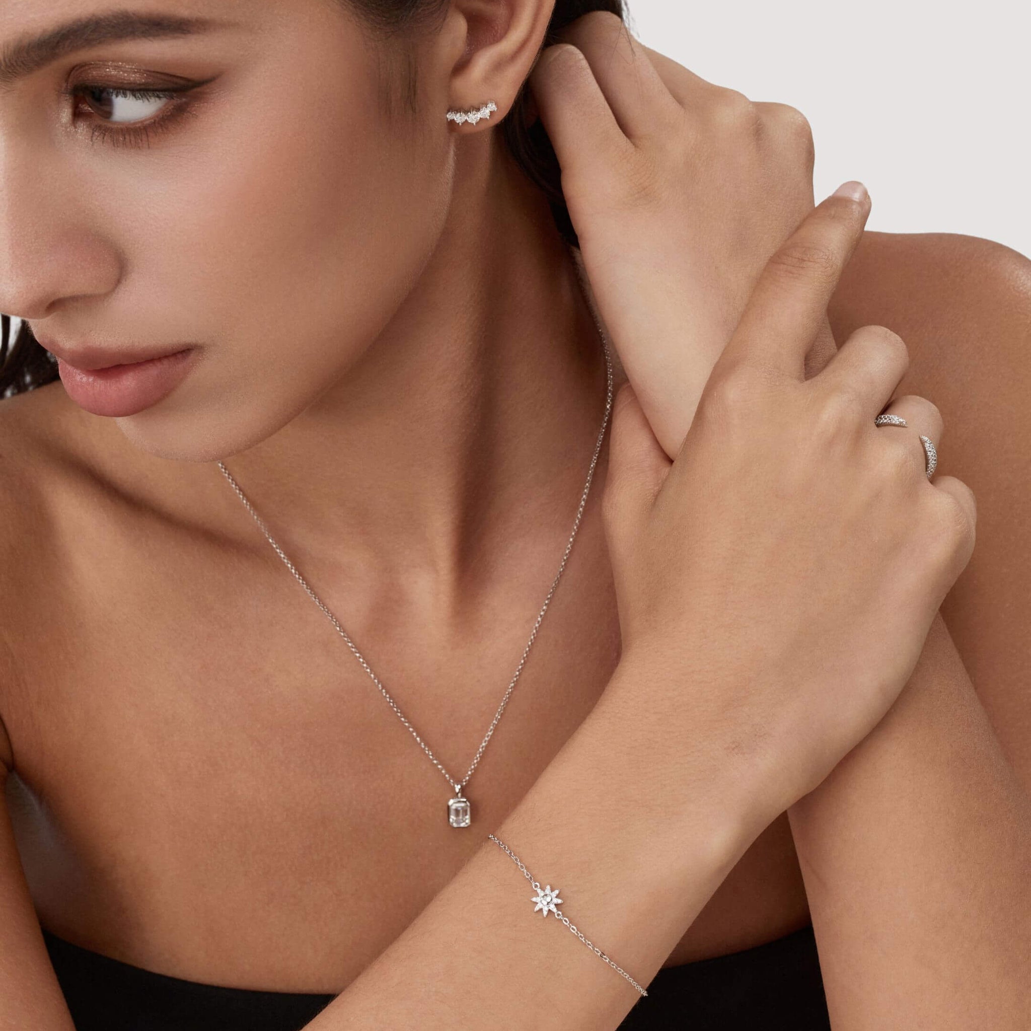Pavé moissanite sunburst bracelet worn on the wrist.