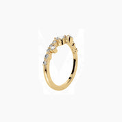 Pear-cut and marquise-cut moissanite cluster ring in yellow gold vermeil, side view.