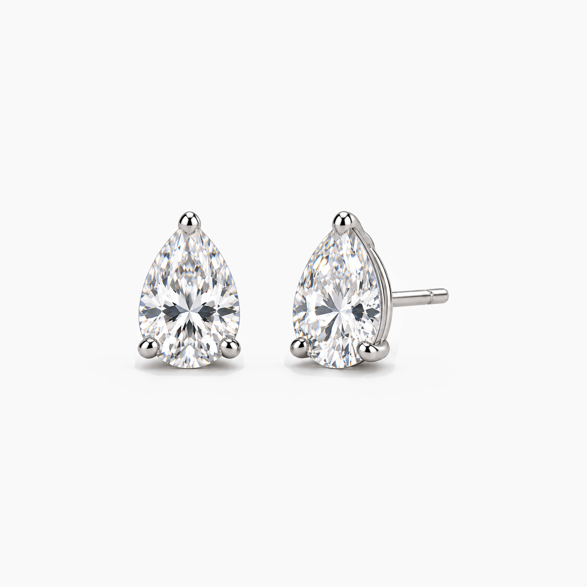 Pear-cut lab-grown diamond stud earrings in 14k white gold, front and three-quarter views.
