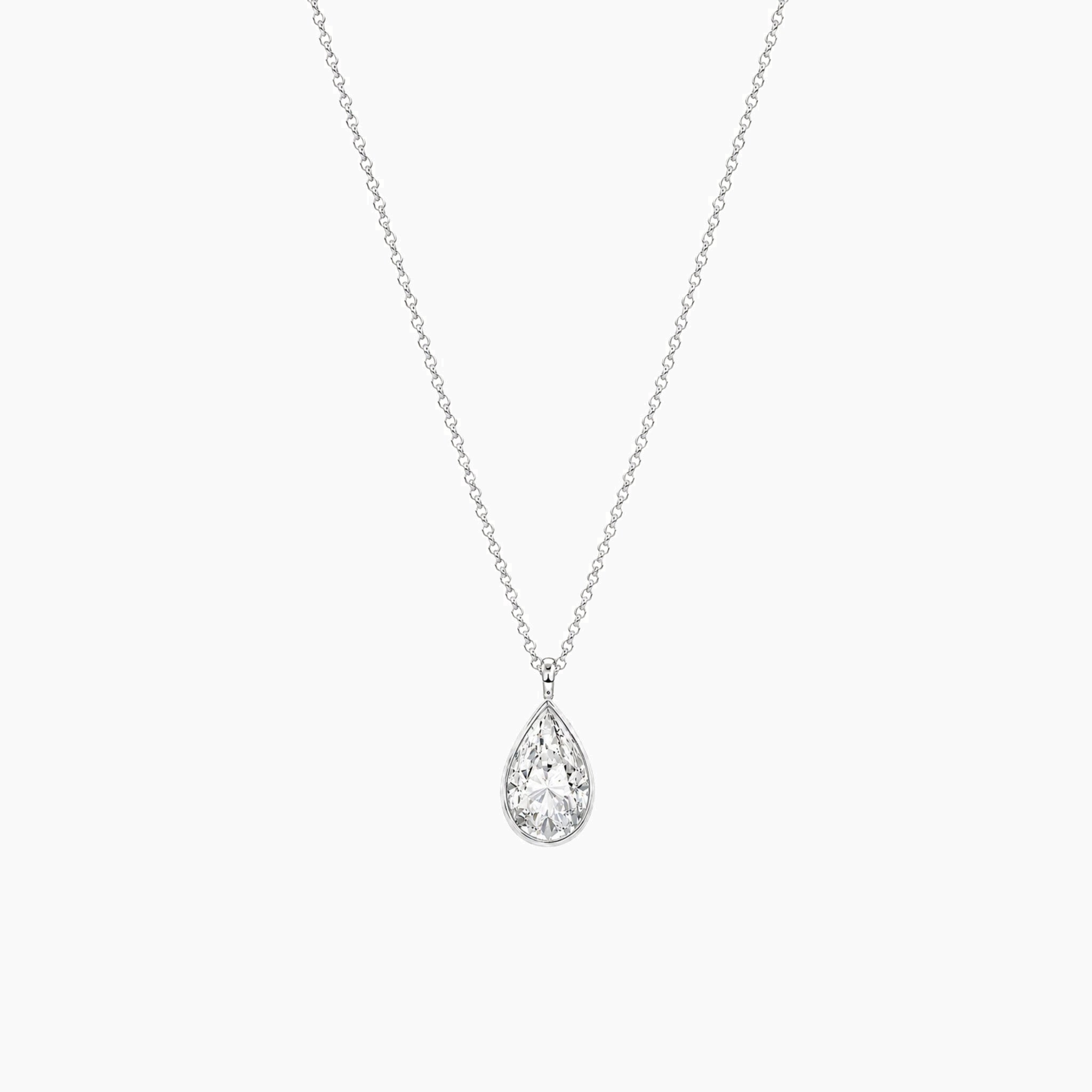 Pear-cut moissanite bezel pendant necklace in white gold vermeil, full product view.