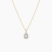 Pear-cut moissanite bezel pendant necklace in yellow gold vermeil, full product view.