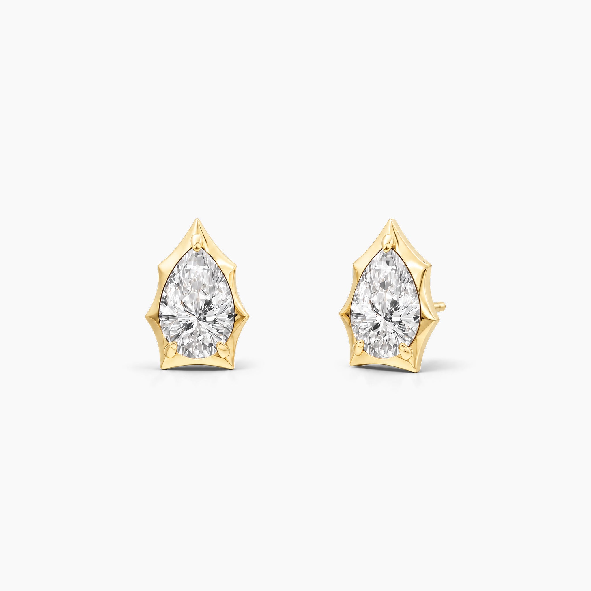 Pear-cut moissanite bezel-prong stud earrings in 18k yellow gold vermeil, front and angled views.