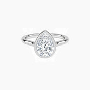 Pear-cut moissanite bezel solitaire ring in white gold vermeil, front view.