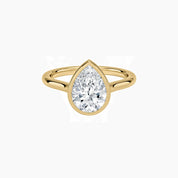 Pear-cut moissanite bezel solitaire ring in yellow gold vermeil, front view.