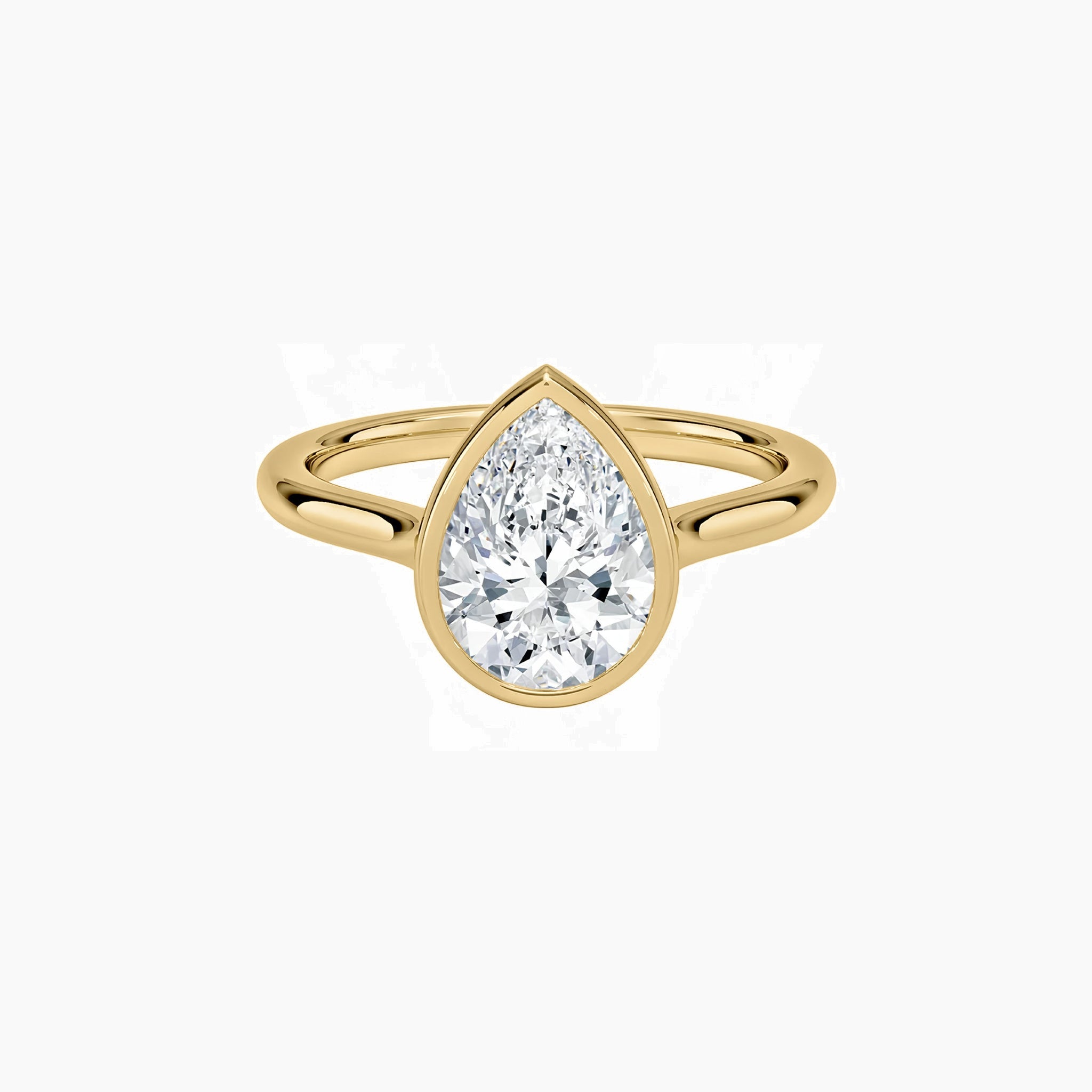 Pear-cut moissanite bezel solitaire ring in yellow gold vermeil, front view.