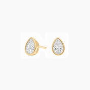 Pear-cut moissanite bezel stud earrings in yellow gold vermeil, front and side views.