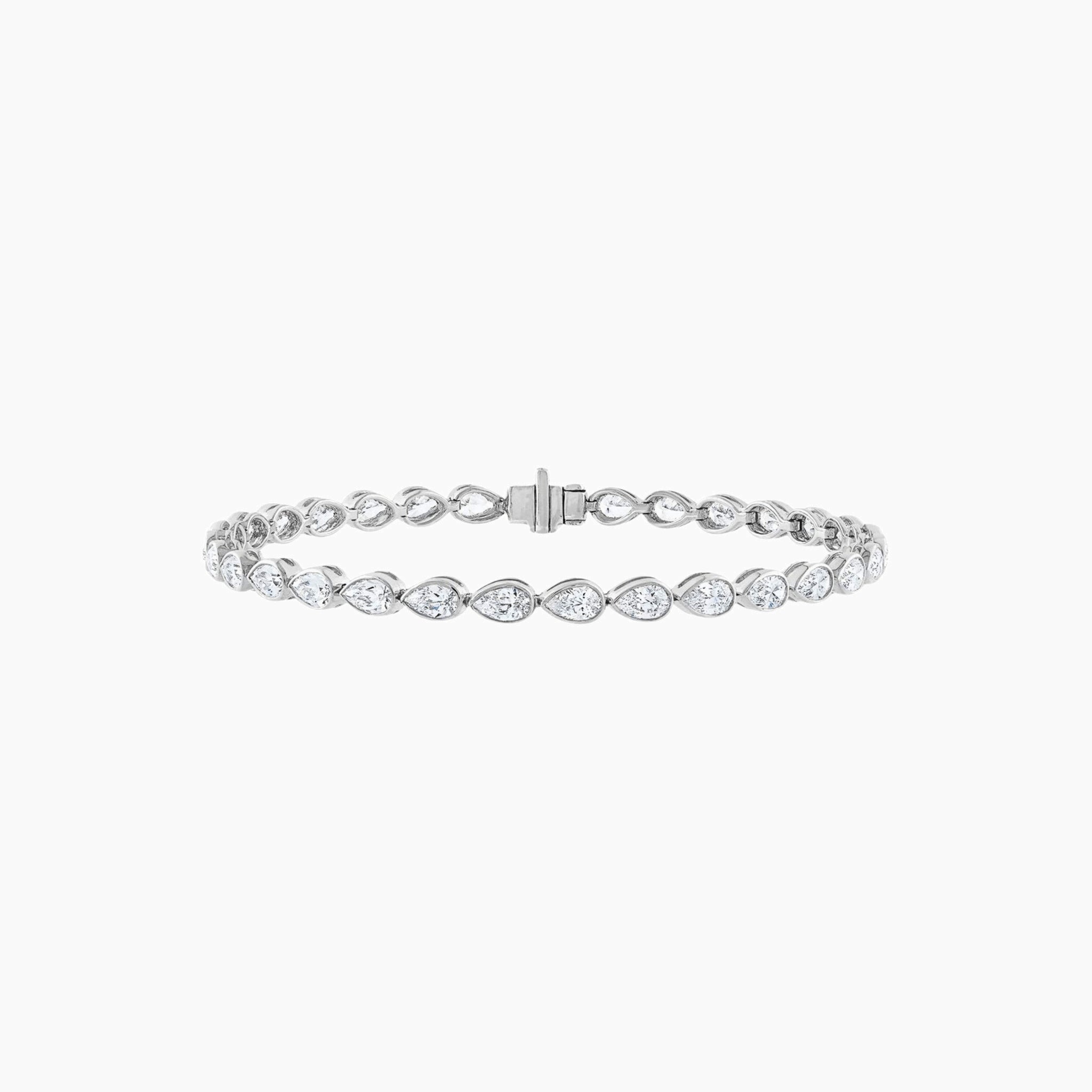 Pear-cut moissanite bezel tennis bracelet in white gold vermeil, closed view.